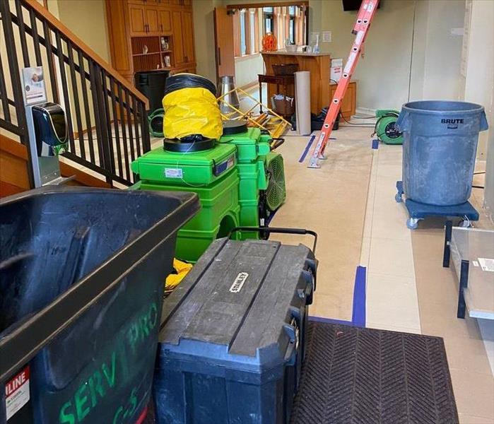 SERVPRO waste bin and drying equipment with ladder in school office