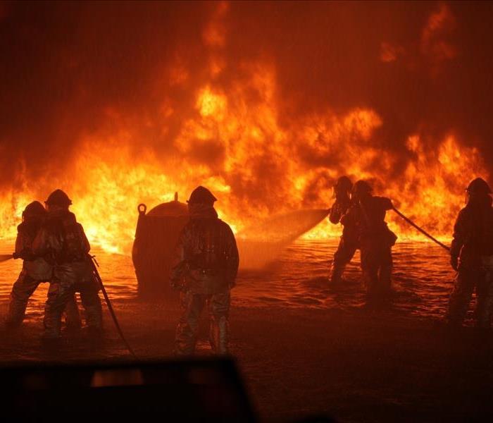 firemen fighting a large fire